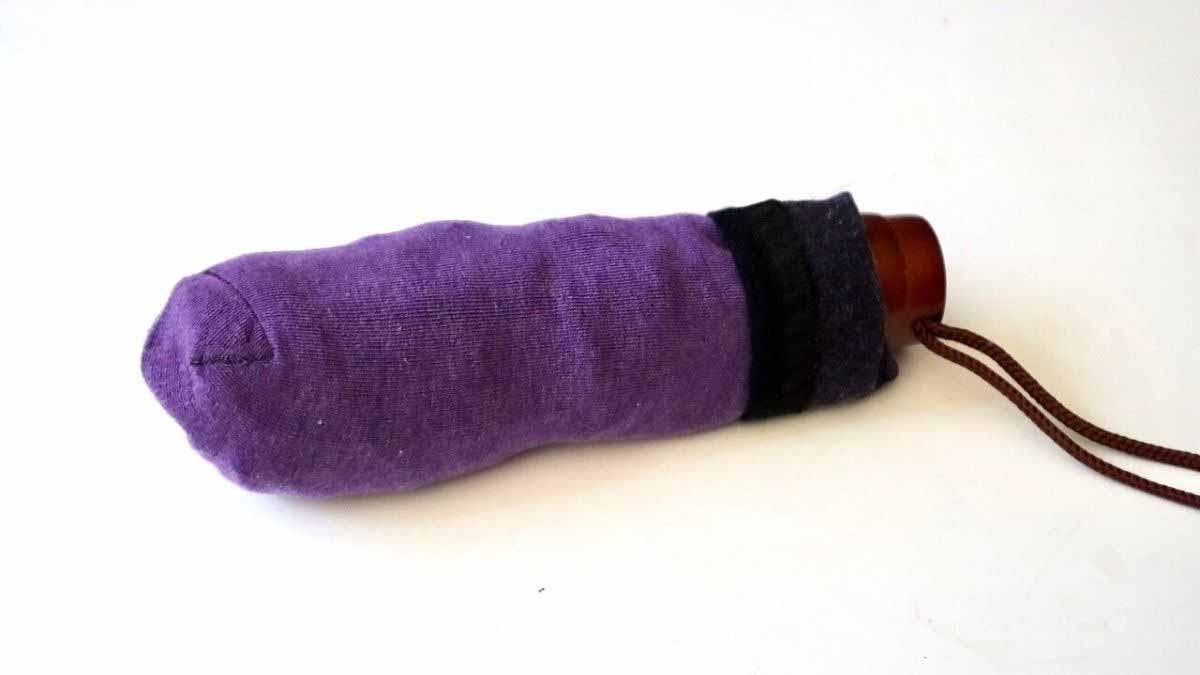 Transform an old sock into an umbrella case