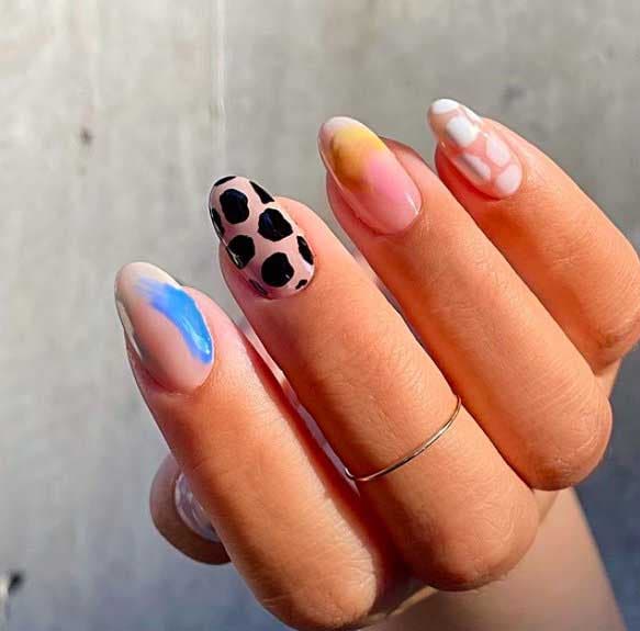 Nail art différent sur chaque ongle avec motifs animaliers